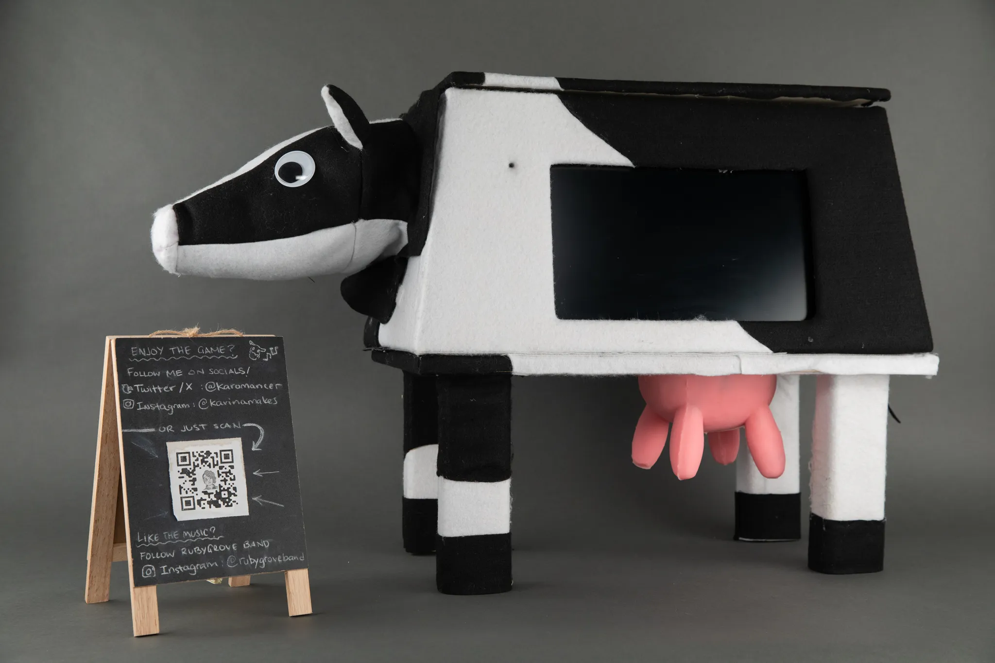 A photograph of a close up of a cow-shaped arcade cabinet