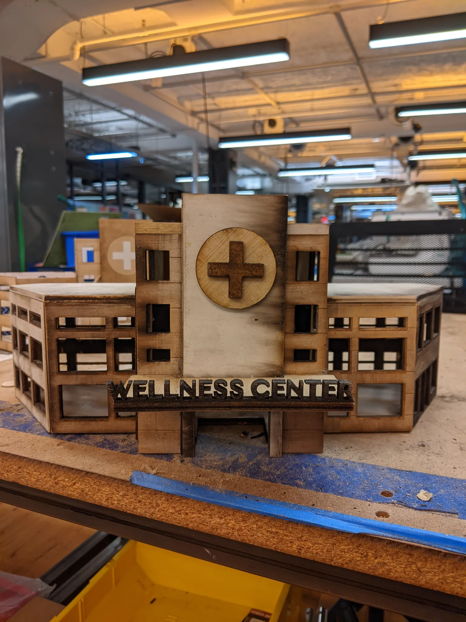 Photograph of the front of a wooden model hospital