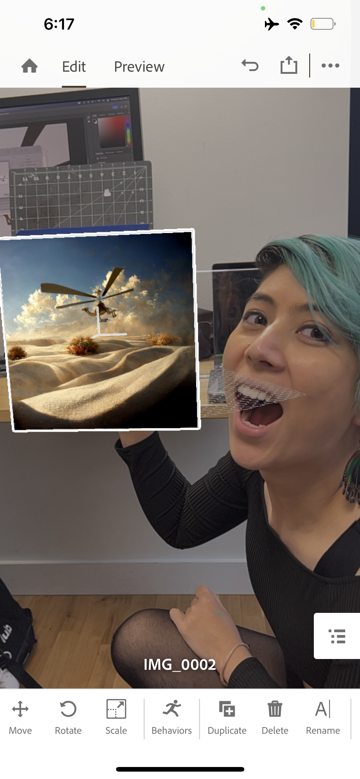 Screenshot of the view from a camera of a woman holding up a picture in AR space