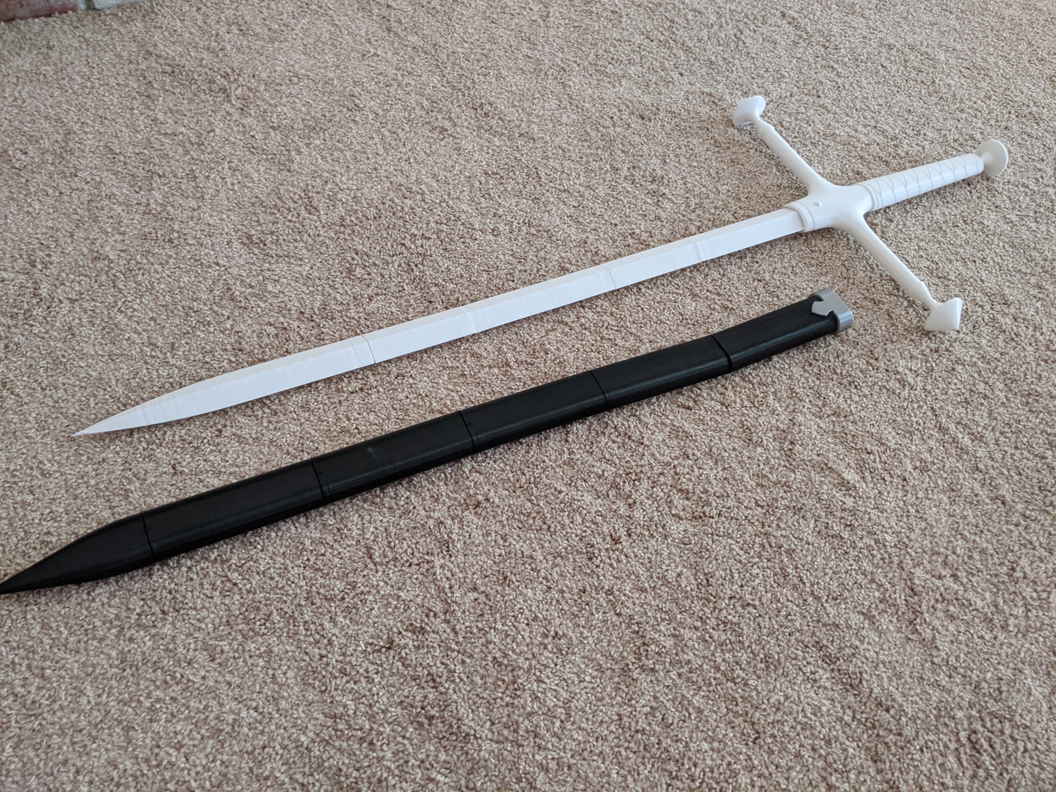 Photograph of a finished 3D printed sword with all pieces assembled