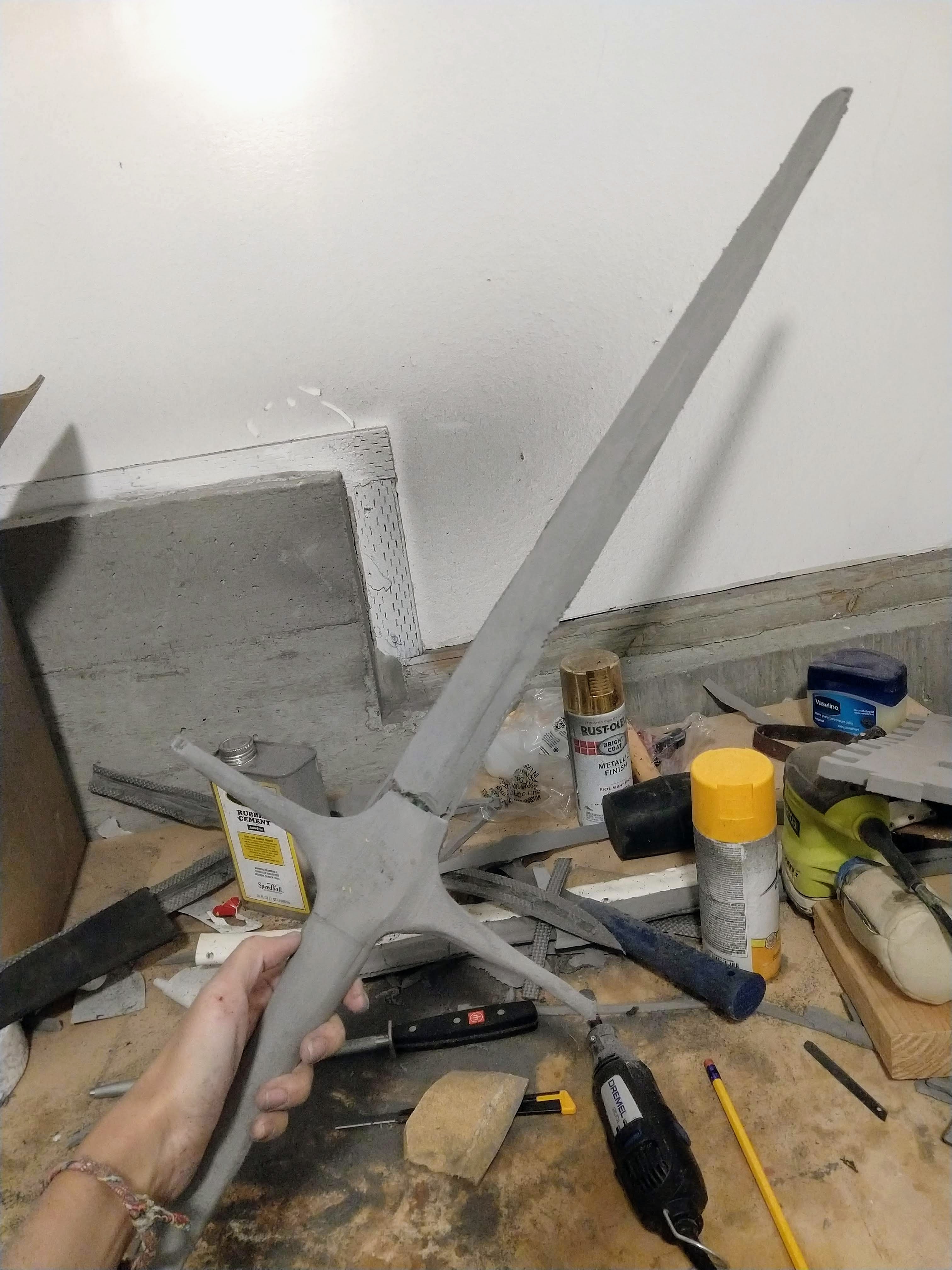 Photograph of a freshly carved foam sword with rough edges