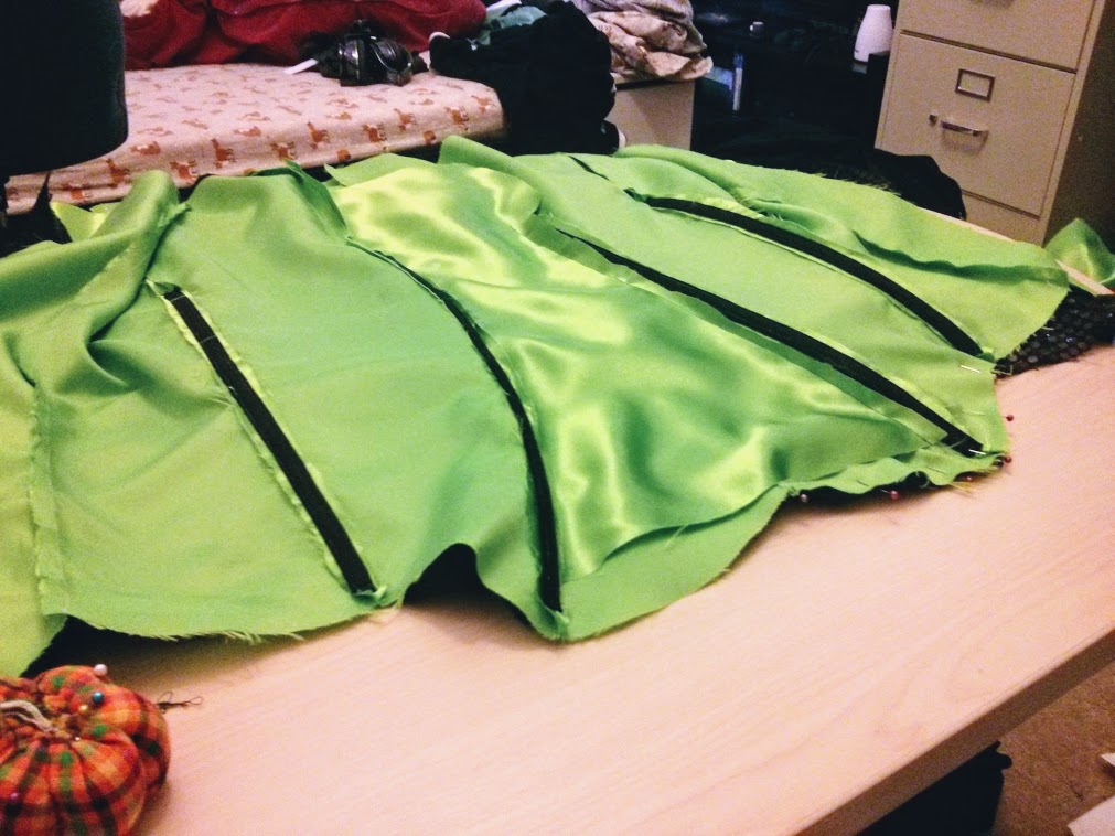 Photograph of green fabric with black boning sewn in