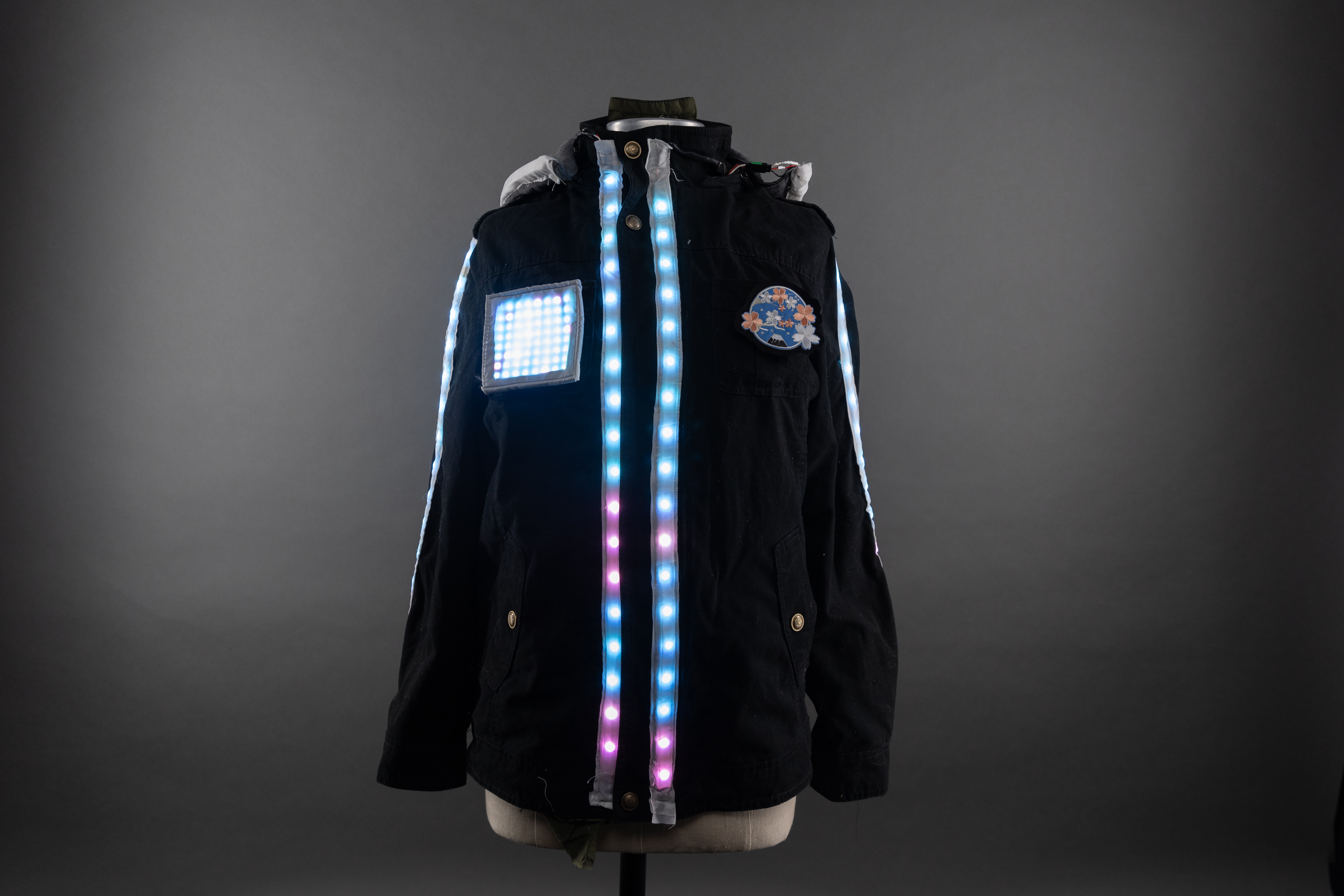 Photograph of the front of a jacket with LEDs running down the front