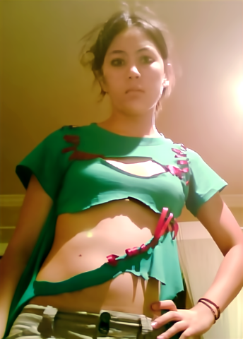 Photograph of a girl wearing a torn up green shirt, front